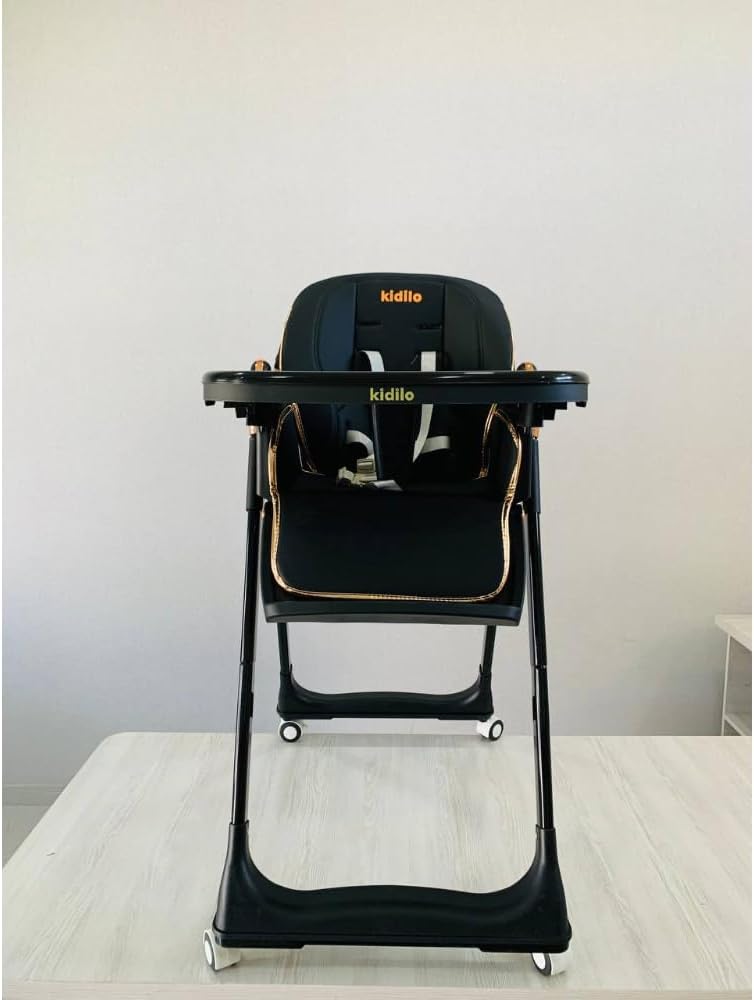 The Kidilo premium high chair features a luxurious, comfortable design suitable for mealtime. It comes equipped with a harness featuring multiple safety points and a cup holder, and boasts a sturdy, stable frame, distinctive wheels, and a seat (Black).