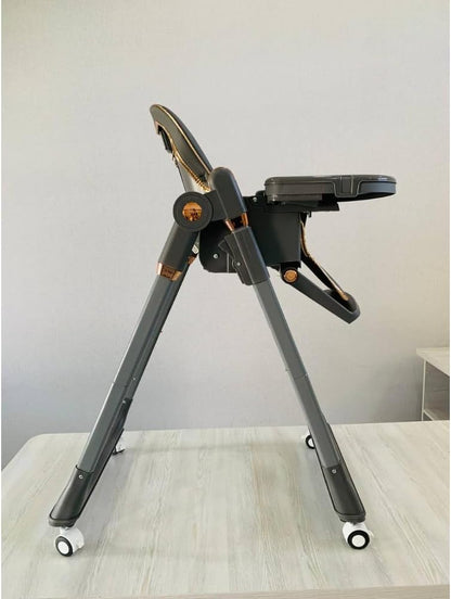 The Kidilo high chair features a modern design and an elegant gray color, providing comfort and safety for your child during mealtime. It is equipped with a comfortable, padded seat and a safety harness to keep the child secure (Gray).