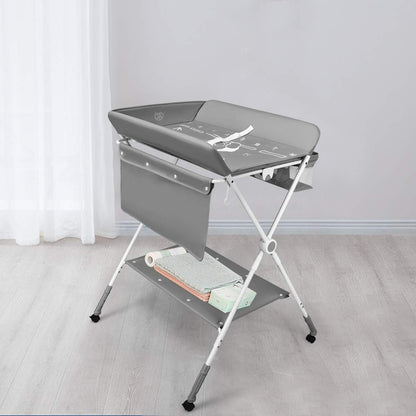 A foldable baby changing and dressing table, featuring storage baskets and side pockets, a spacious bottom shelf, and wheels for easy mobility—the ideal, practical solution for every mother to make baby care easier and more comfortable!